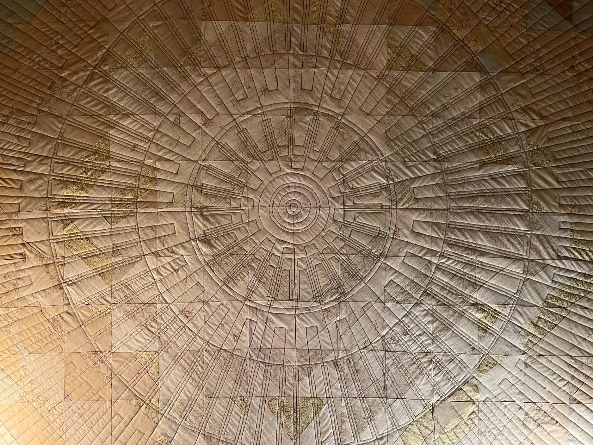 Close-up of the layered spoked quilting on the finished Shimmering Headboard